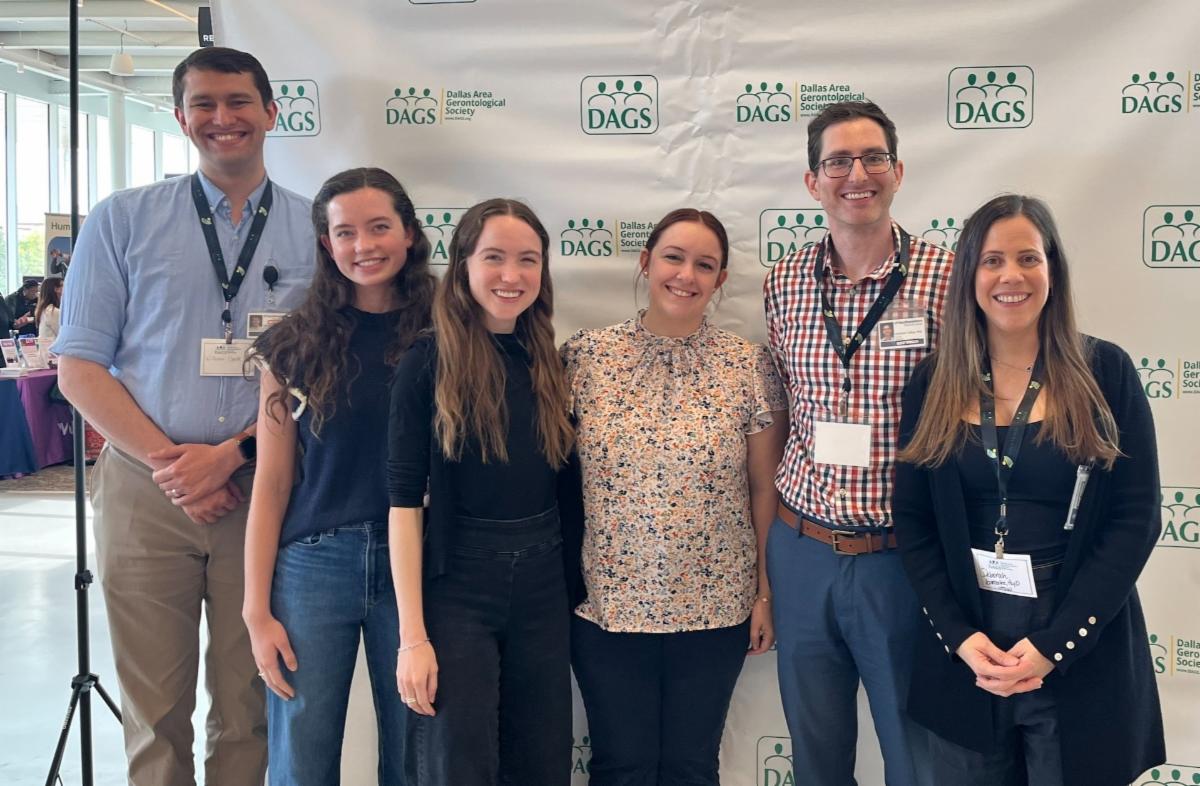 A picture of six doctors and medical students standing in front of the DAGS backdrop