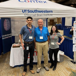 Sebastian Chowdhury_Dr. Stephen C. Bunt_and Ingrid Tamez stand in front of a booth at SWATA