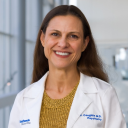 Head and shoulders photo of Jennifer Coughlin in a white coat