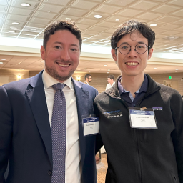 Drs. Monsalve and Chiu-Han posing for camera in a conference room