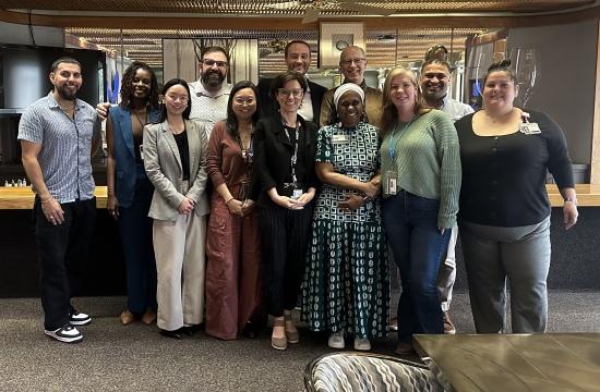 The FY27 Retreat Committee stands for a photo after a planning meeting.