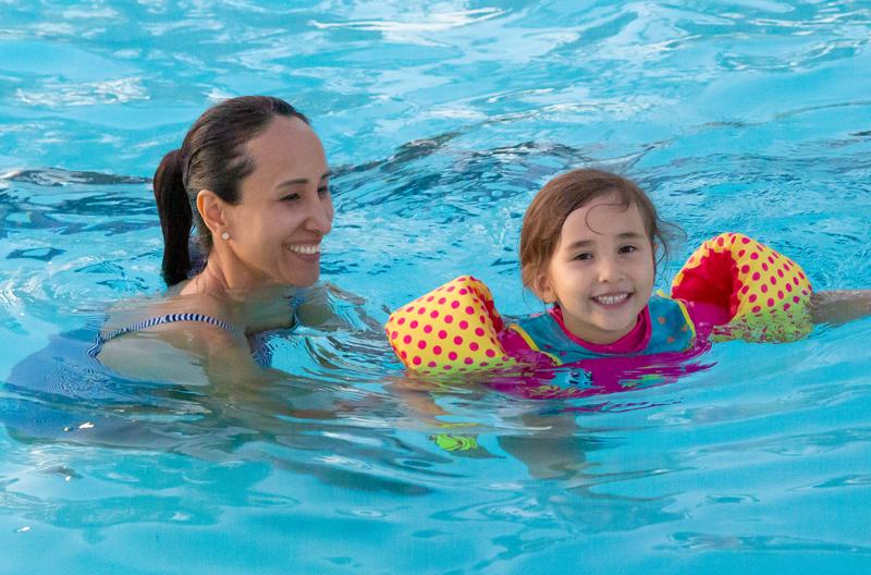Adult and child in pool