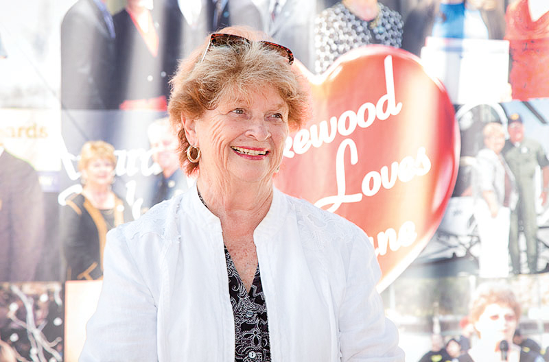 Diane DuBois in front of Lakewood Loves Diane poster
