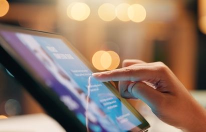 Hands_ tablet or person reading screen for business with online advice_ review feedback and research. Technology_ night and manager in office with internet report_ newsletter and career information