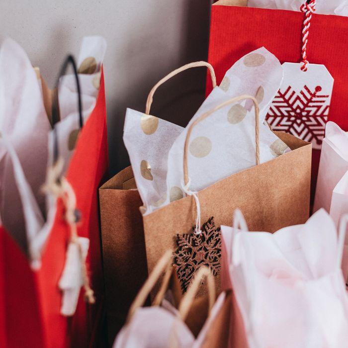 A variety of holiday gift bags for a holiday boutique