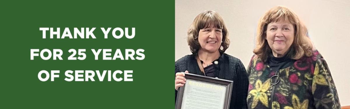 Photo of Dagmar with her recognition certificate standing next to Suzanne Shenfil Text reads thank you for 25 years of service 