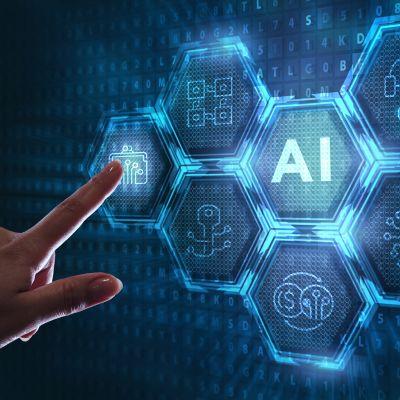 Image of finger pointing at a screen that reads AI