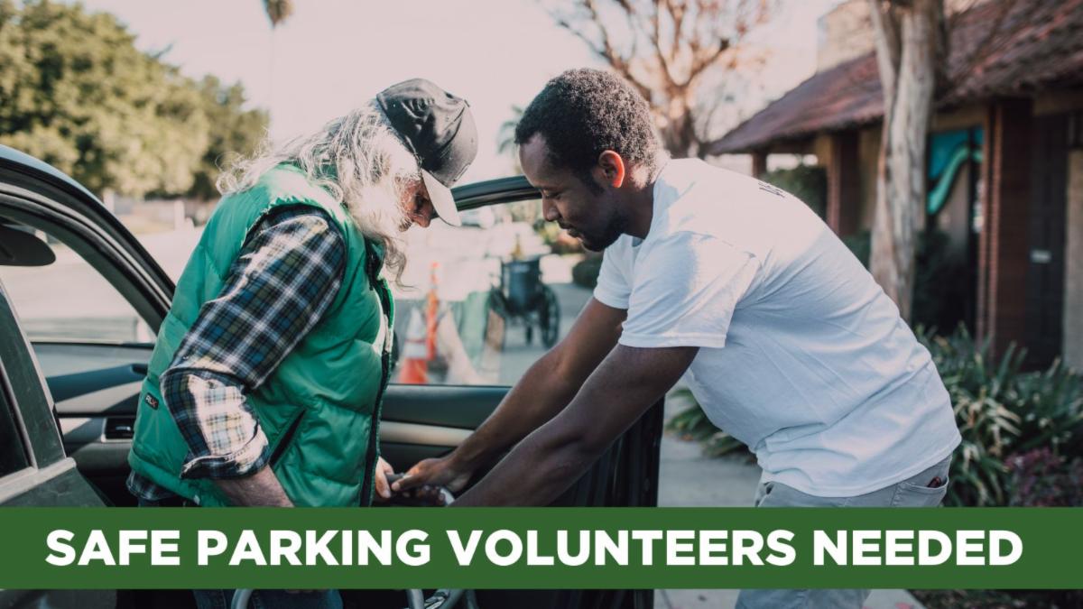 Image of a man assisting an elderly person out of a car 
