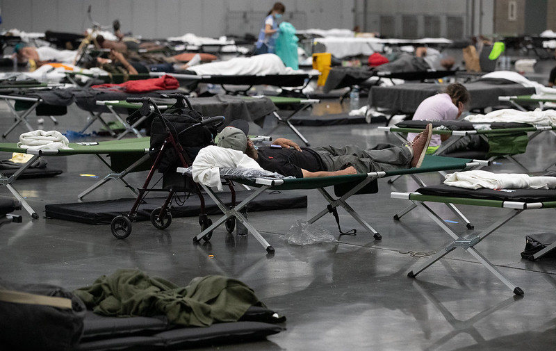 People on cots at the Oregon Convention Center Cooling Center