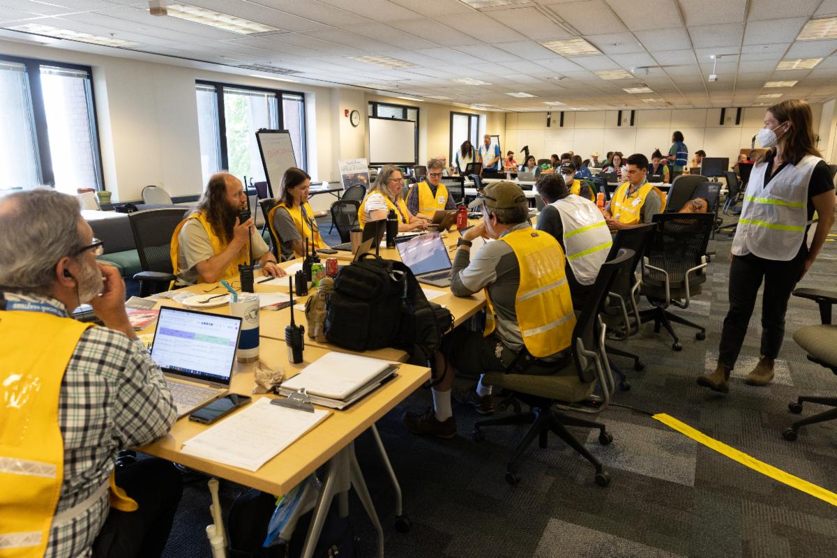 The Logistics section in yellow vests with radio communications support