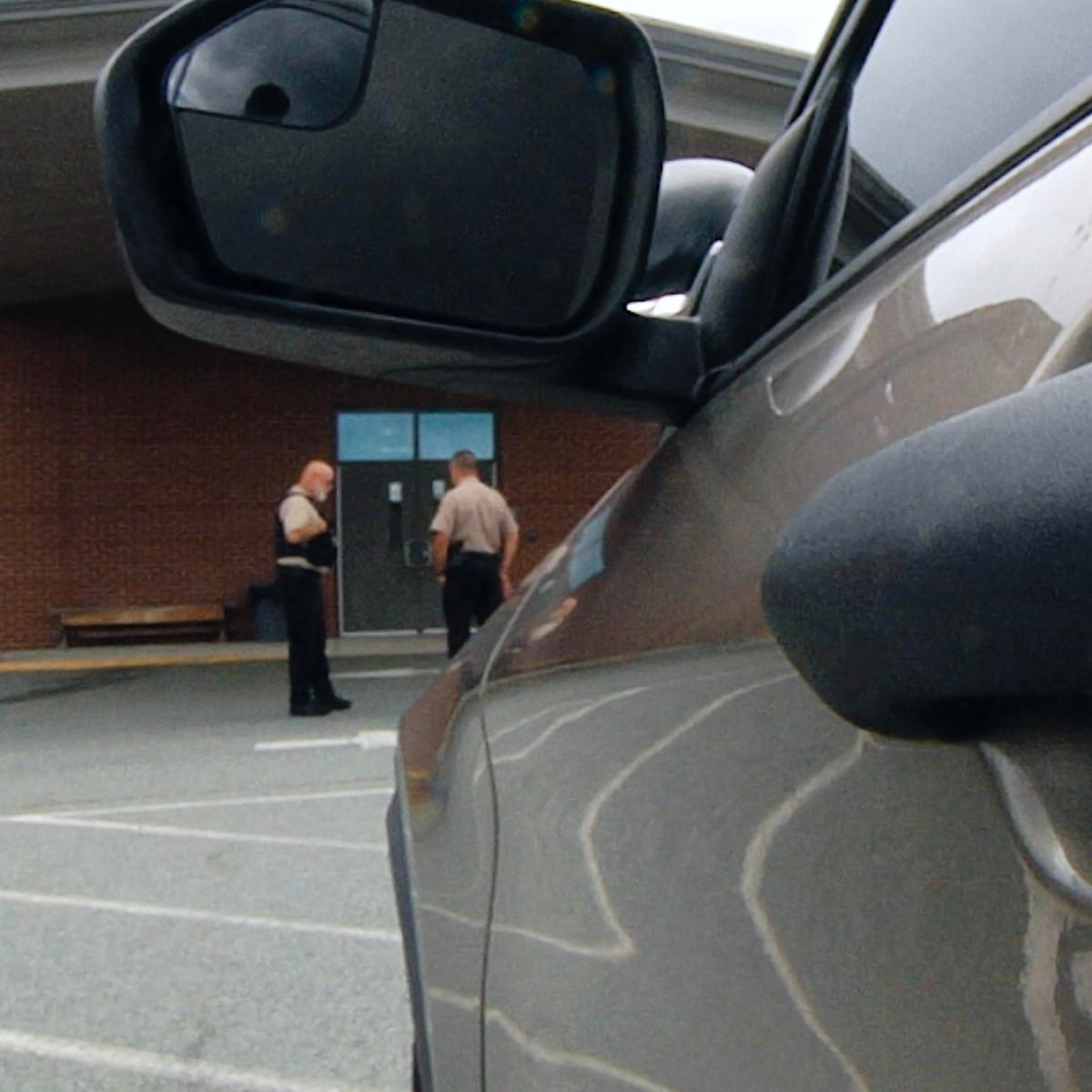 Photo of car with 2 police offers