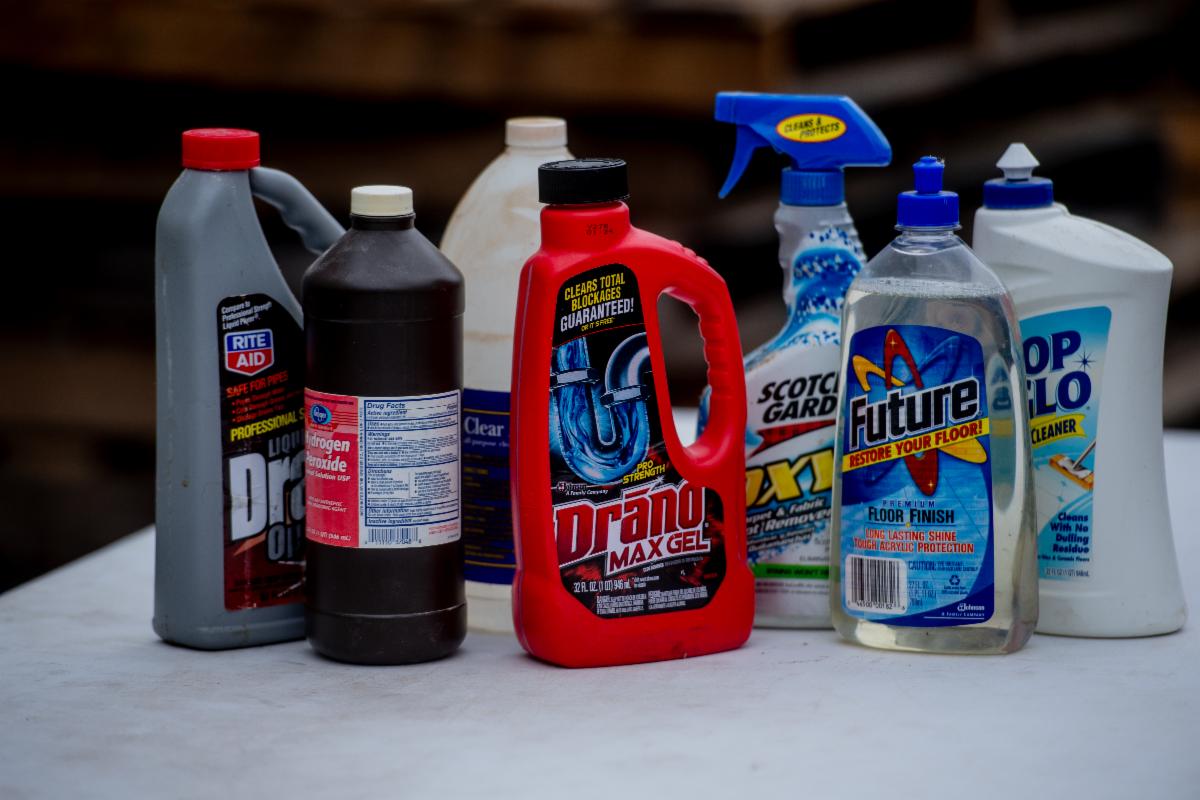 photo of various household hazardous waste products like drain cleaner, bathroom cleaners, hydrogen peroxide, carpet cleaner