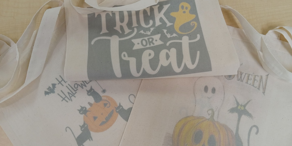 canvas bag that says trick or treat