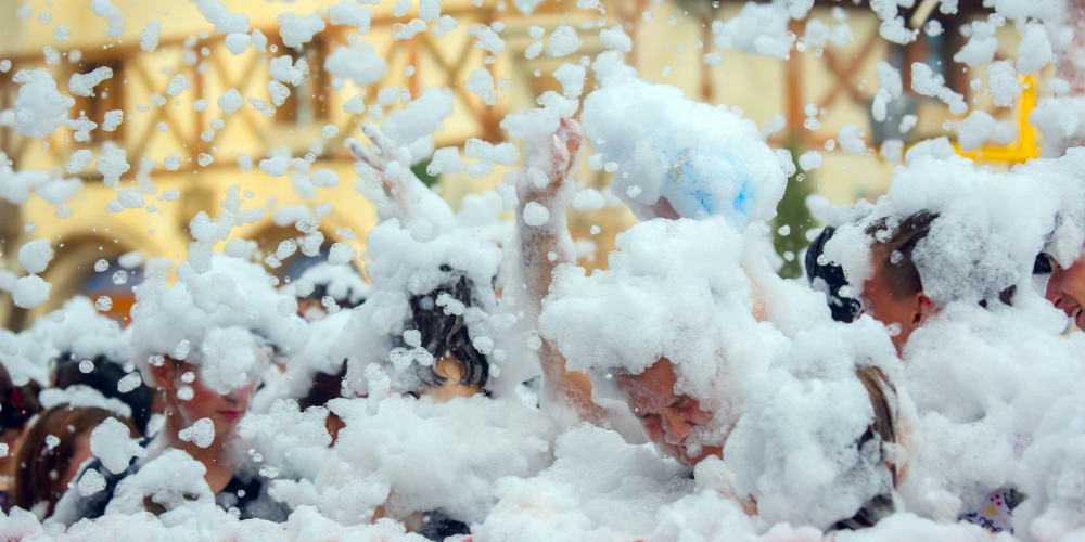 kids playing in soap foam