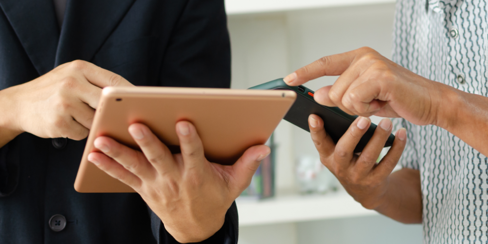 hands holding a tablet