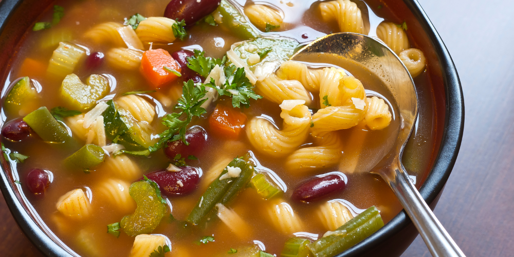 bowl of soup with pasta, beans, and veggies