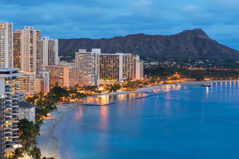Scenic view of Honolulu city Diamond Head and Waikiki Beach at night  Hawaii USA