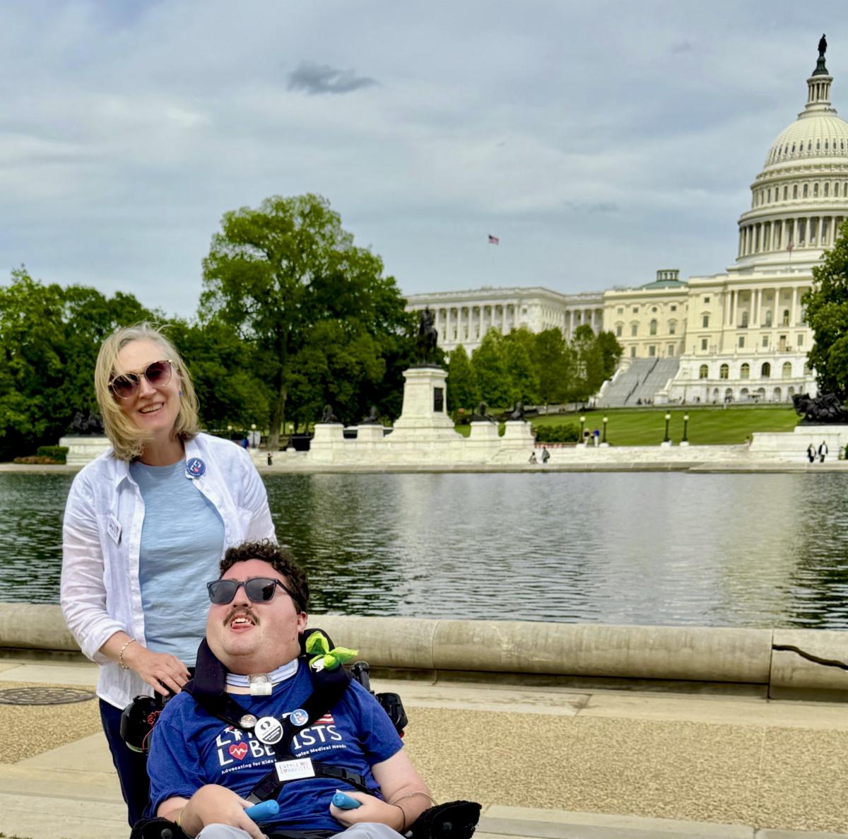 Jeneva Stone and her son Rob, who uses a wheelchair, stand in front of the US capital building in Washington DC
