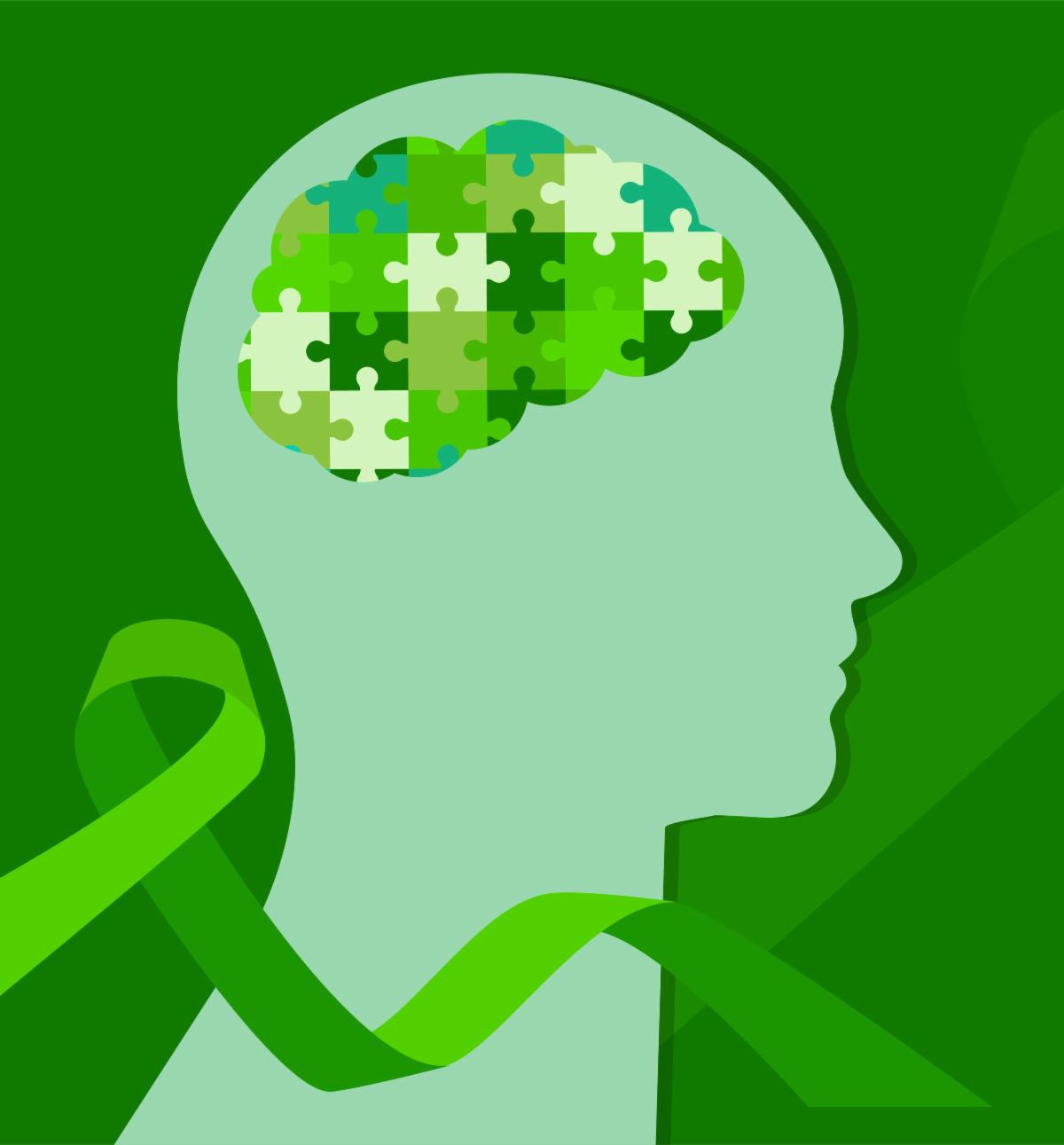A graphic image in shades of green of a sillouetted head in profile with puzzle pieces where brain should be and a green ribbon flowing around the head