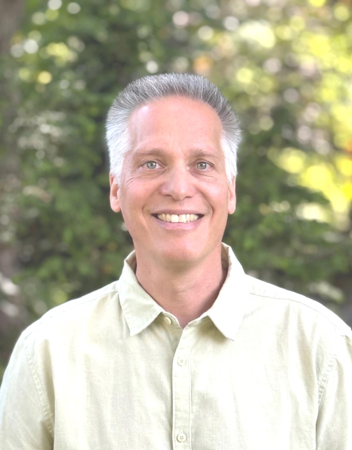 Headshot of Richard Boyers who is smiling and wearing a light green shirt