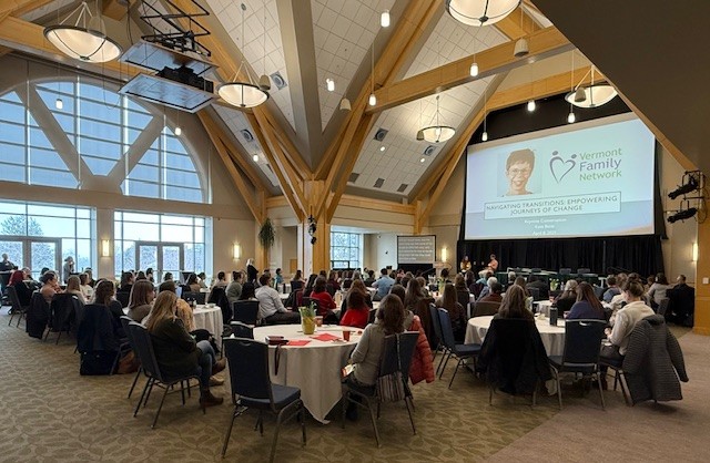 Photo of the 2025 VFN annual conference in the UVMDavis Center ballroom with particiapnts at tables and speaker in front