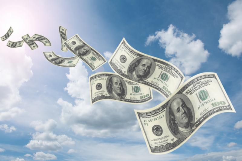 A graphic of dollar bills flying through a blue sky with white clouds