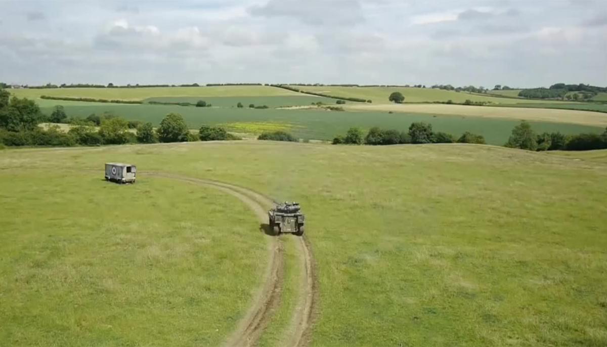 Military vehicle driving on a field