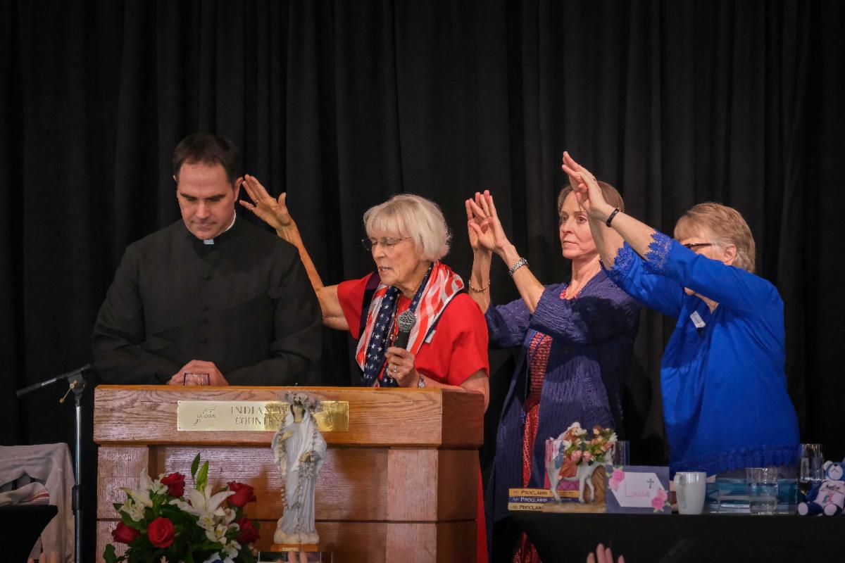 Praying over Fr. Calloway PD 3.12.2022.jpg