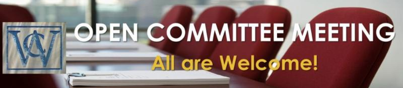 A conference table with empty chairs around it.  Open Committee Meeting!  All are Welcome