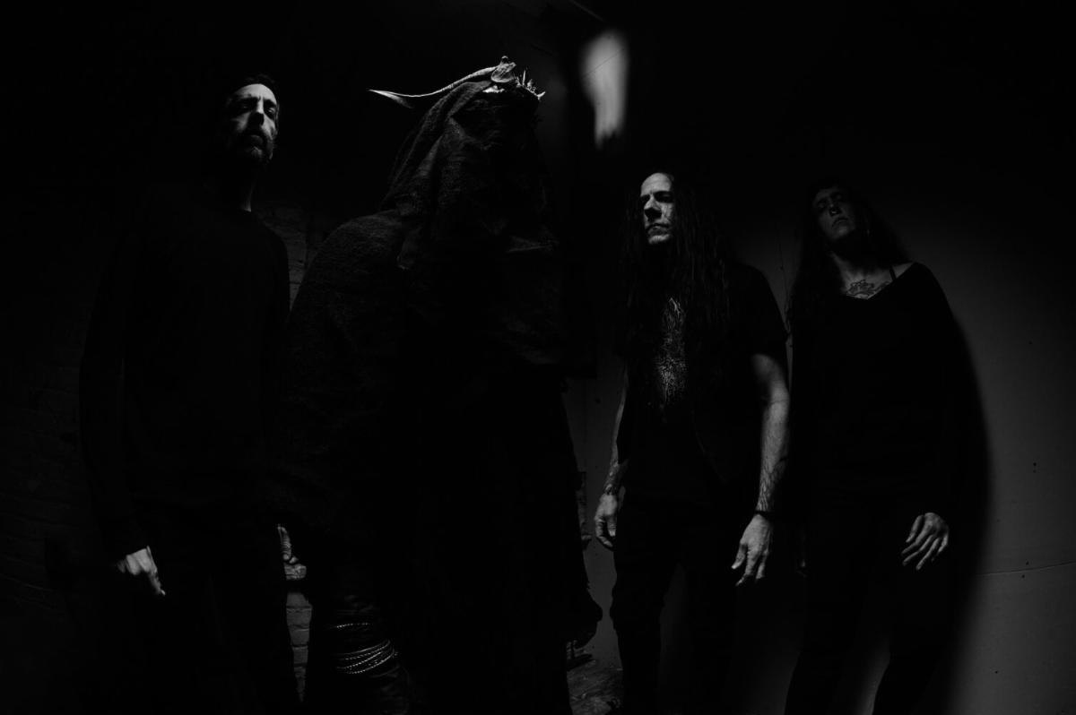 Nixil band photo, black and white, members in masks