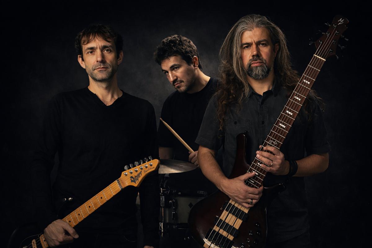 Sins of Shadows band photo, a black and white image of three band members posing.