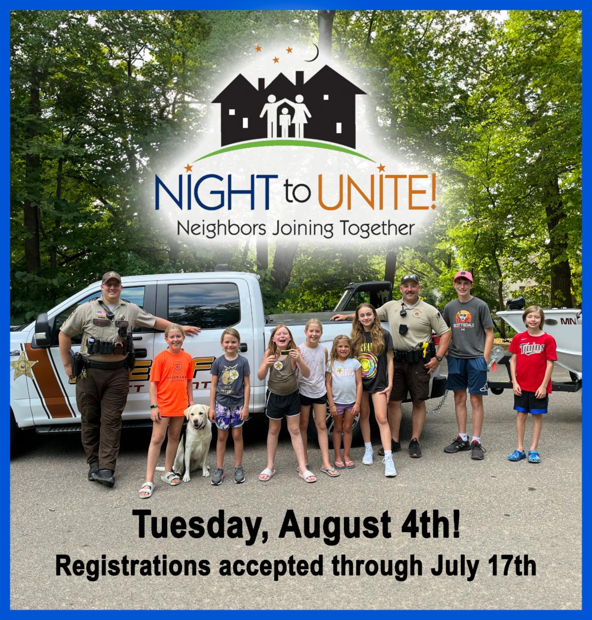 Night to Unite with a group of kids and police officers smiling for the photo