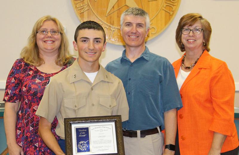 Clancy Forlano with his parents Kyle and Richard Forlano and Board Vice President Sherry Harrison