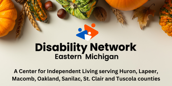 Below fall gourds nuts leaves and wheat stalks is the Disability Network Eastern Michigan logo. The text says a Center for Independent Living serving Huron Lapeer Macomb Oakland Sanilac St. Clair and Tuscola counties.
