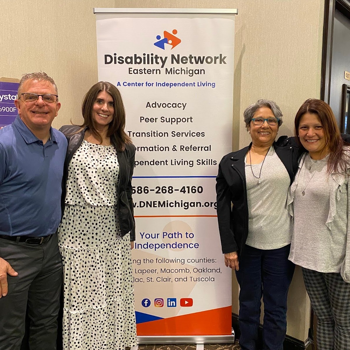 Four staff from Blue Cross and Blue Shield of Michigan, an Art from the Heart 2025 sponsor, pose for a photo at the event.