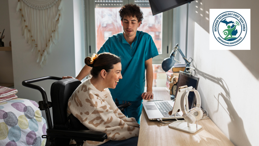 Woman with a motor disability interacting with a laptop at home using assistive technology. A caregiver looks on.