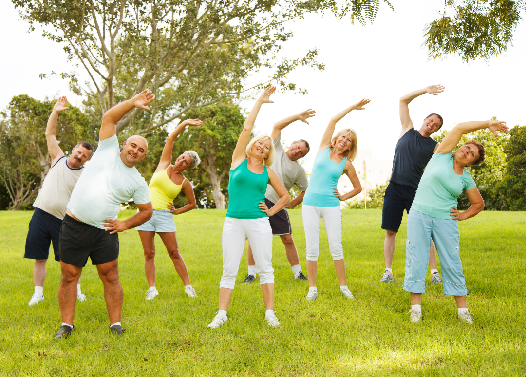 Group of people doing flexibility exercises.