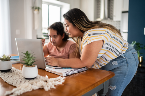 A mother and daughter are applying for benefits together on the MI Bridges website.