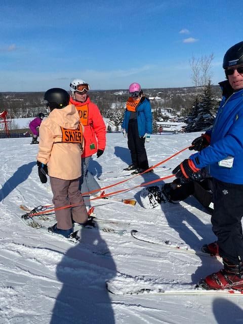 Person preparing for adaptive skiing