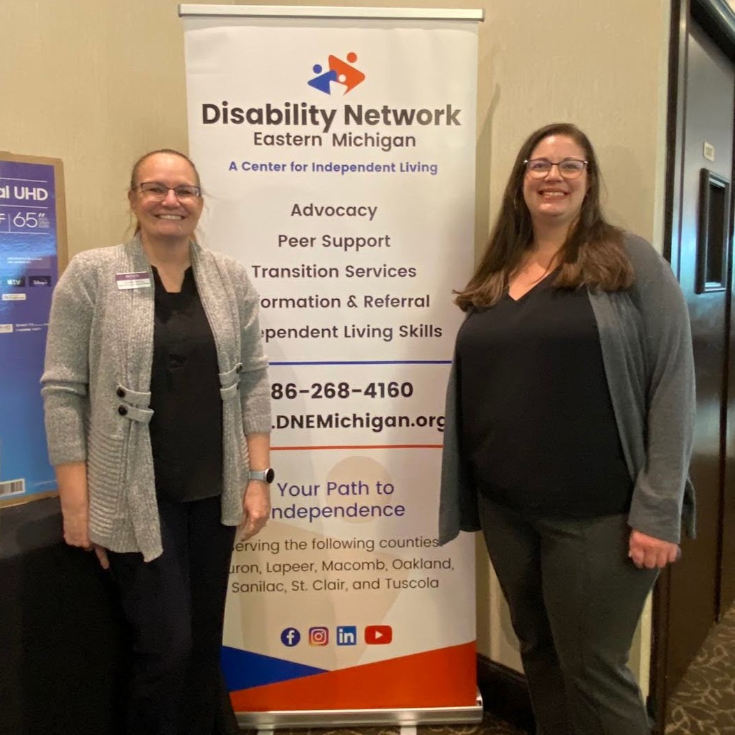 Two staff from Advia Credit Union, an Art from the Heart 2025 sponsor, pose for a photo at the event.