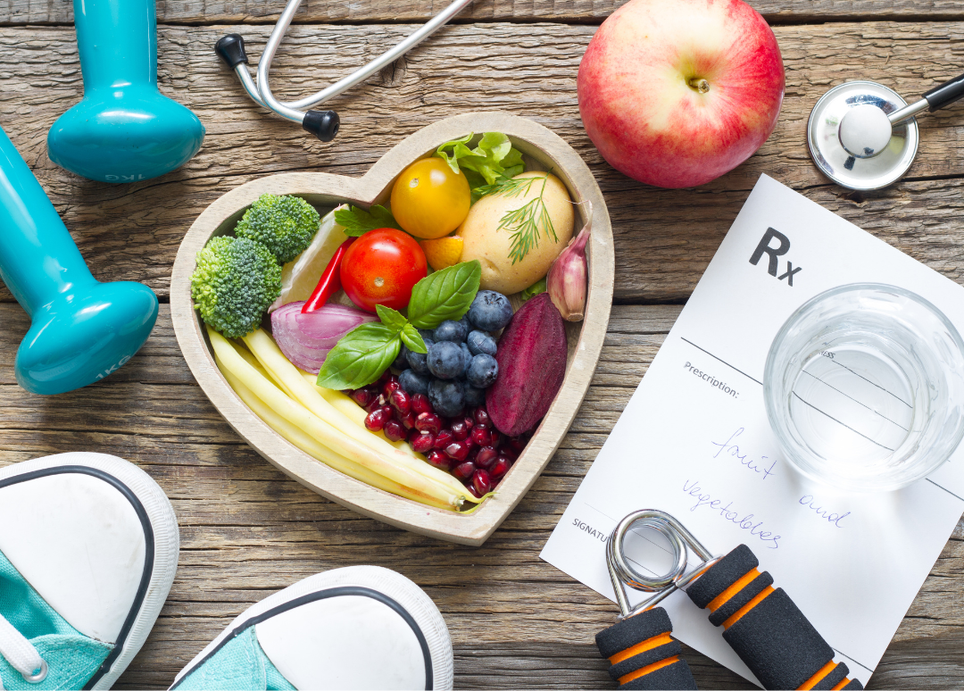 Healthy lifestyle concept includes healthy food exercise equipment stethoscope water and prescription.