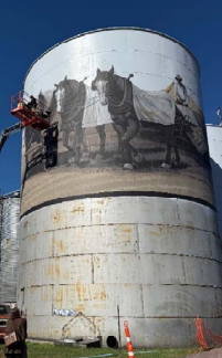 Horse painting on side of round silo