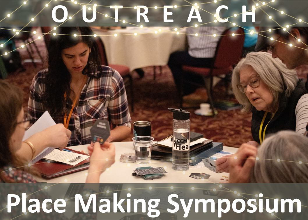 Outreach: Place Making Symposium (people play a board game at a table together)