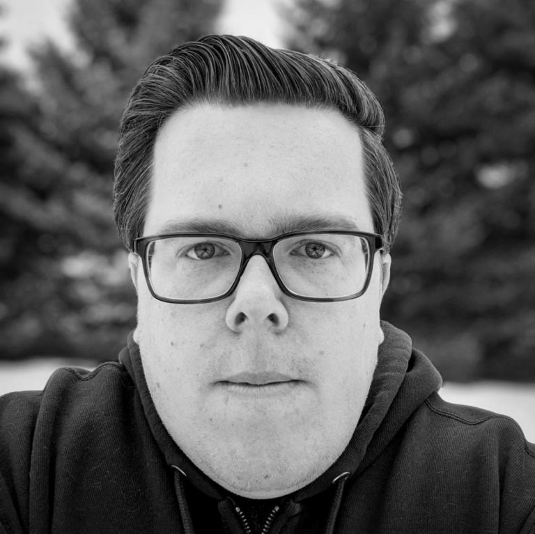 Black and white headshot of Justin Beck