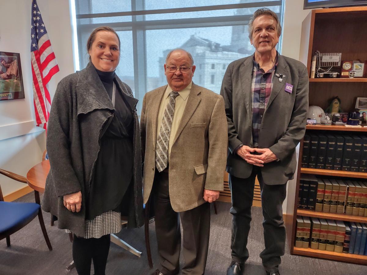 Nicole DeBoer and John Kellen pose with Senator Dahms.