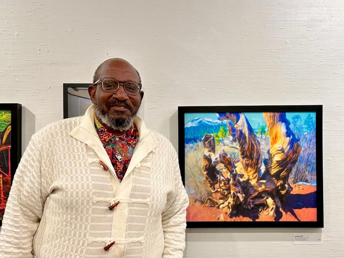Ferman next to artworks