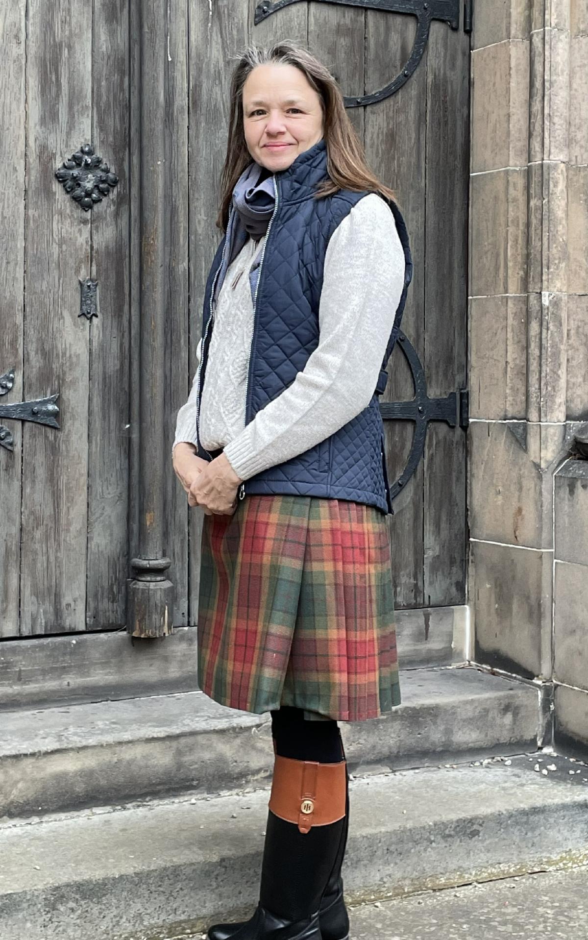 Sheila Tabaka stands in a kilt she made