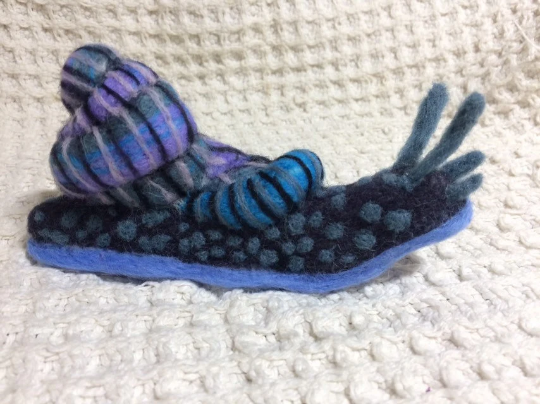 Galaxy colored felted snail by Kirsten Brichler.