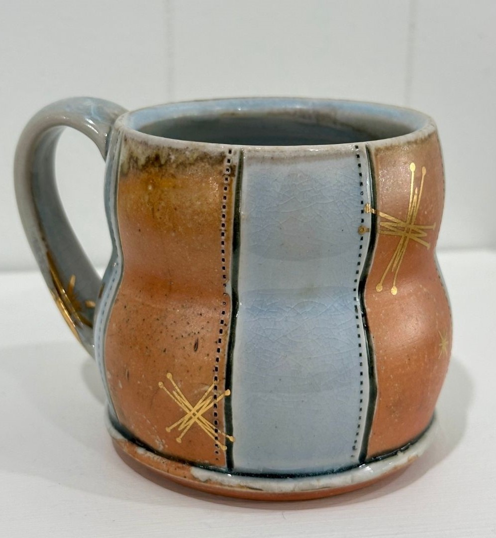Tan and sky blue mug with gold stars