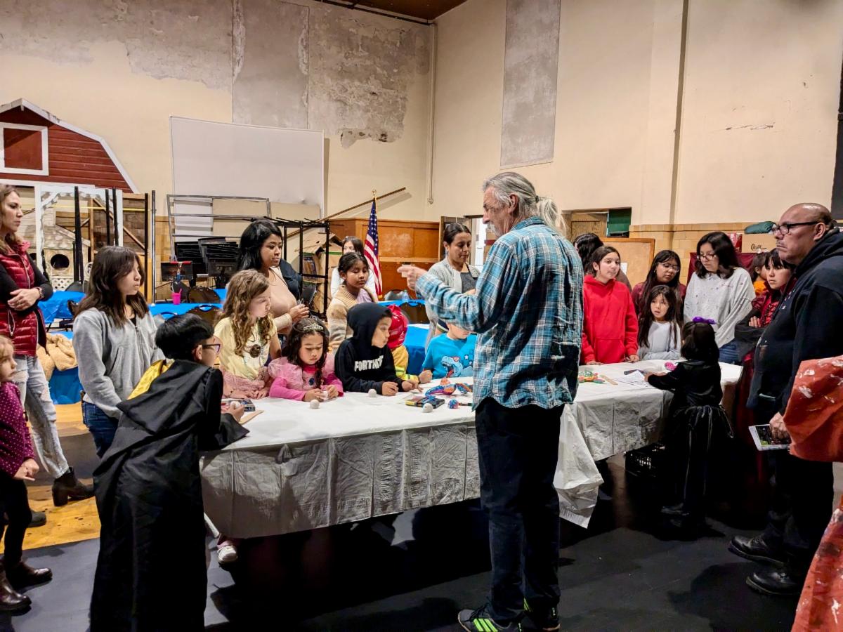 Artist Gustavo presenting at puppet making workshop